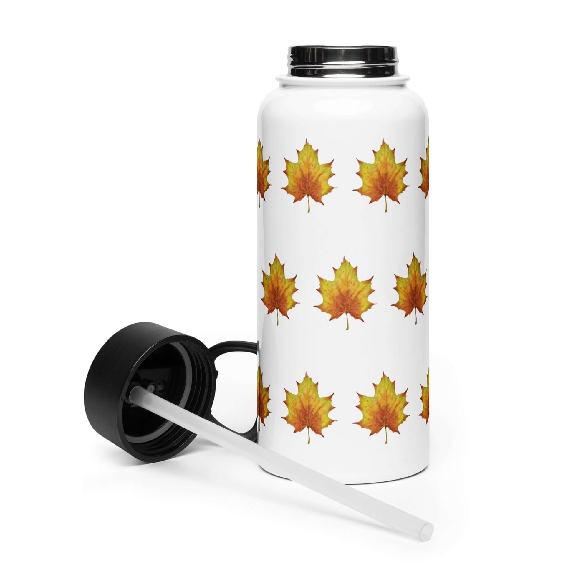 Rustic maple leaf stainless steel tumbler with black lid and straw, ideal for stylish hydration and cottage core gifts.