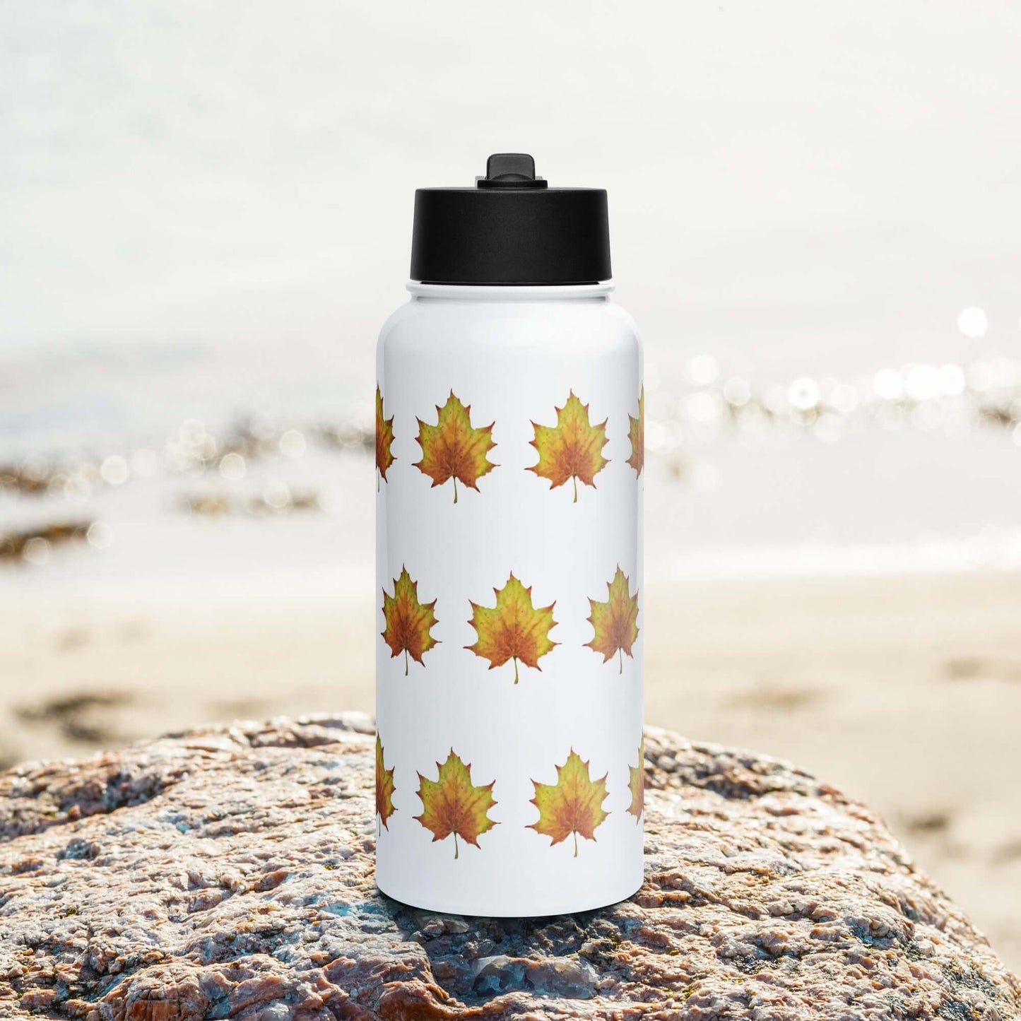 Rustic stainless steel water bottle with maple leaf design, ideal for gifts and outdoor hydration.