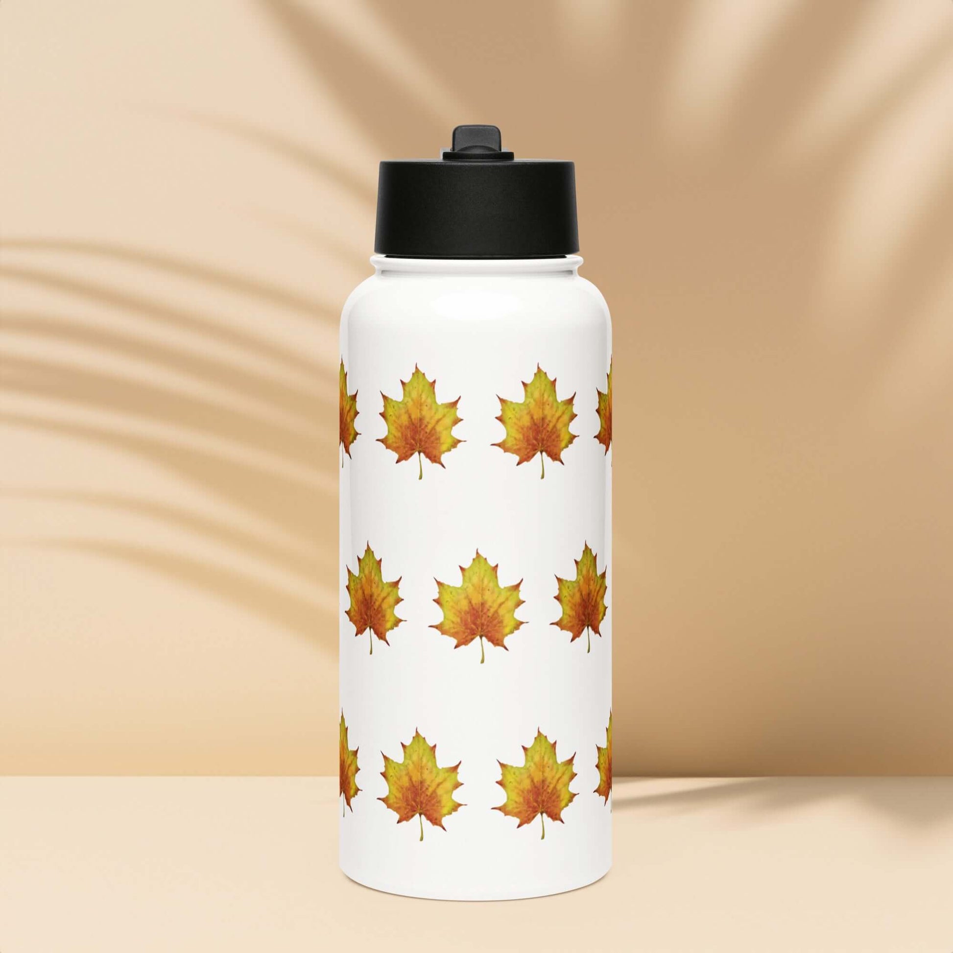 Rustic stainless steel water bottle featuring vibrant maple leaf pattern, ideal for gifts and stylish hydration.