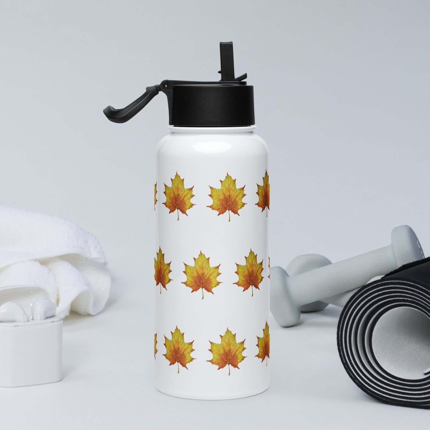 Rustic stainless steel water bottle with maple leaf design, perfect for hydration during workouts or adventures.