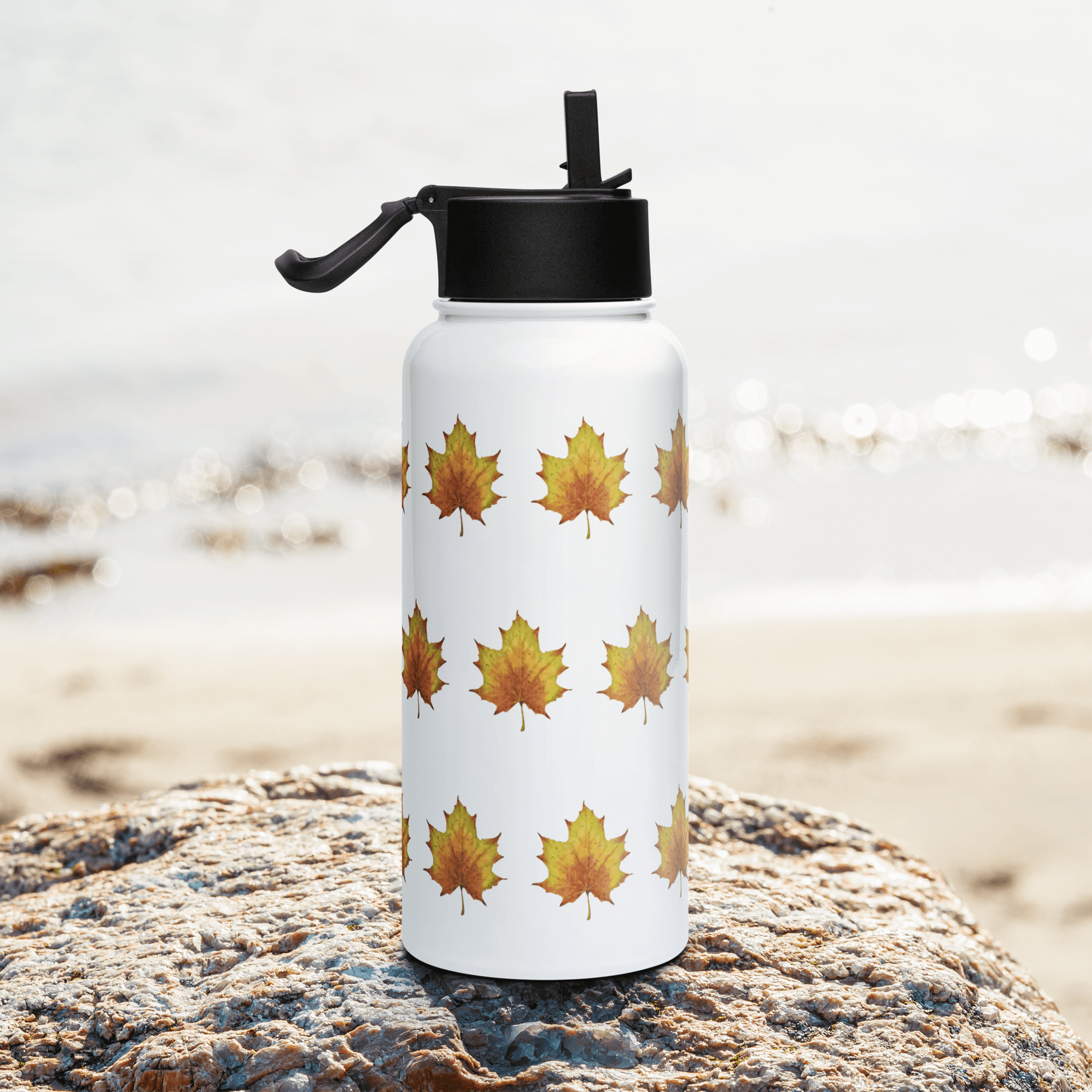 Rustic stainless steel water bottle with colorful maple leaf design, perfect for hydration and gifting.