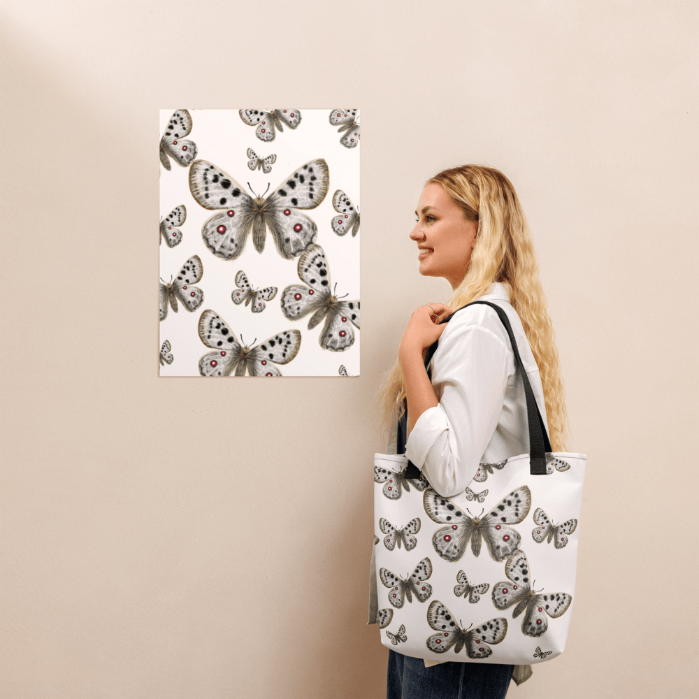 Apollo all-over print tote bag with black handles on a blonde lady's shoulder
