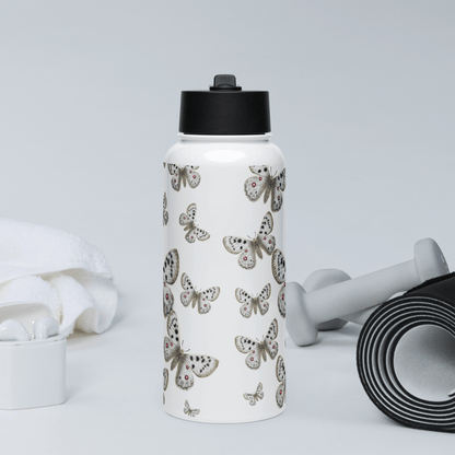 Stylish Apollo butterfly water bottle surrounded by gym accessories, perfect for gifts and travel.