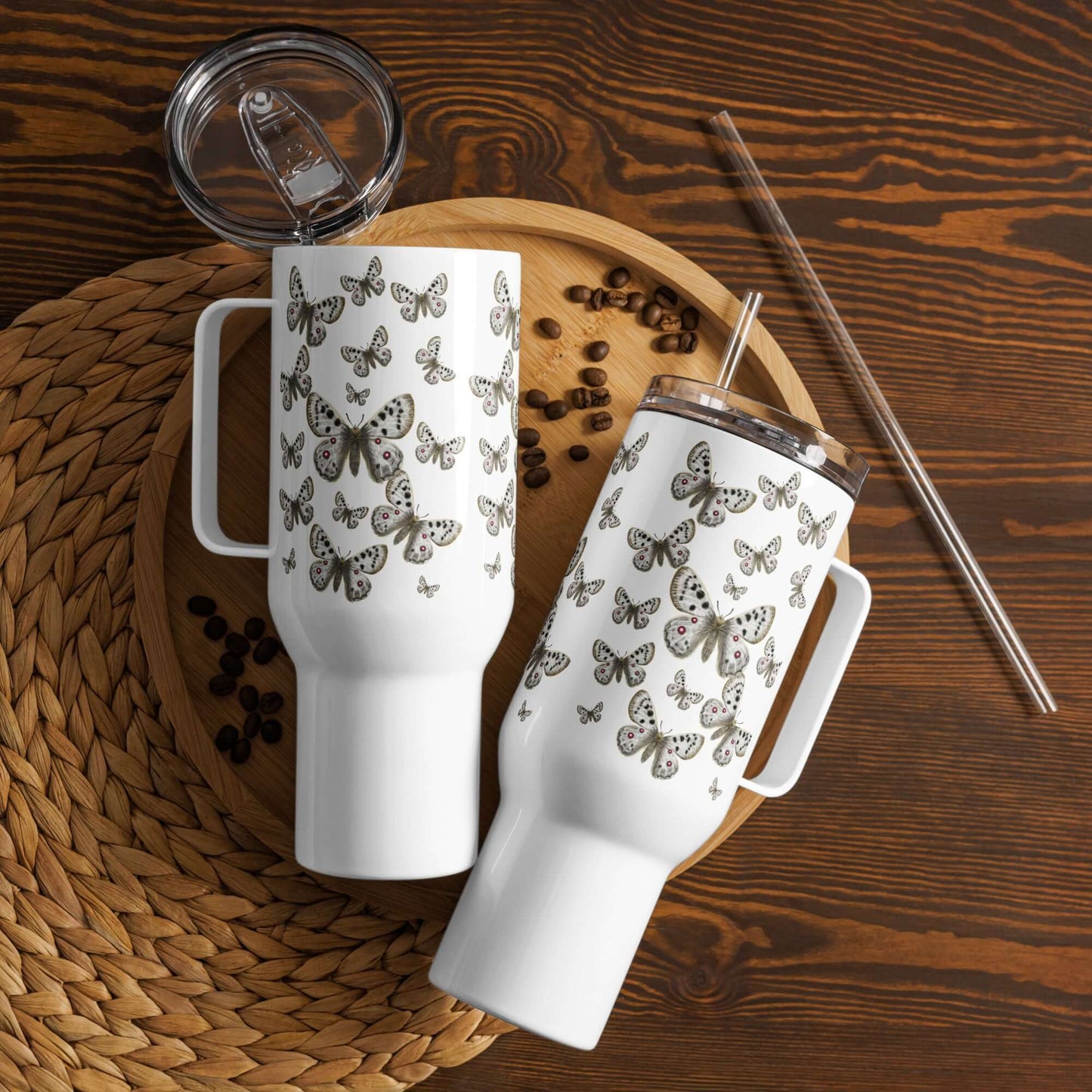 Apollo Butterfly Design Tumblers on a wooden platter with coffee beans, showcasing elegance and functionality in drinkware.