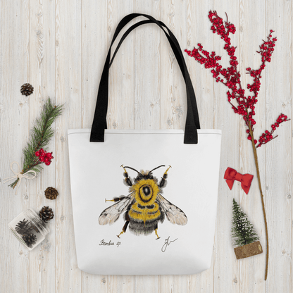 Bumblebee all-over print tote bag with black handles within Christmas decorations like red berry little branch
