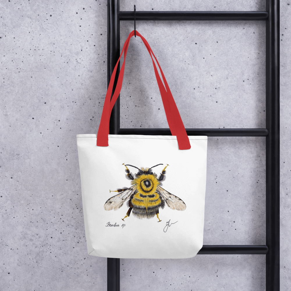 Bumblebee all-over print tote bag with red handles hanging on a ladder
