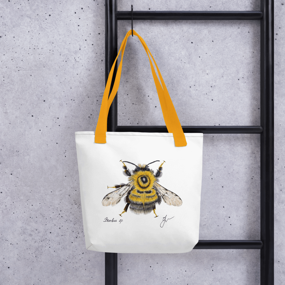 Bumblebee all-over print tote bag with yellow handles hanging on a ladder
