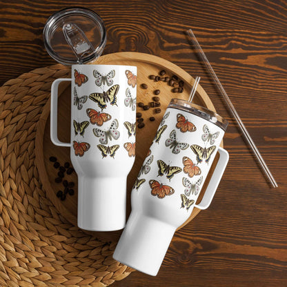 Elegant stainless steel travel tumblers with butterfly designs on a wooden tray with coffee beans. Perfect for drinks on the go.