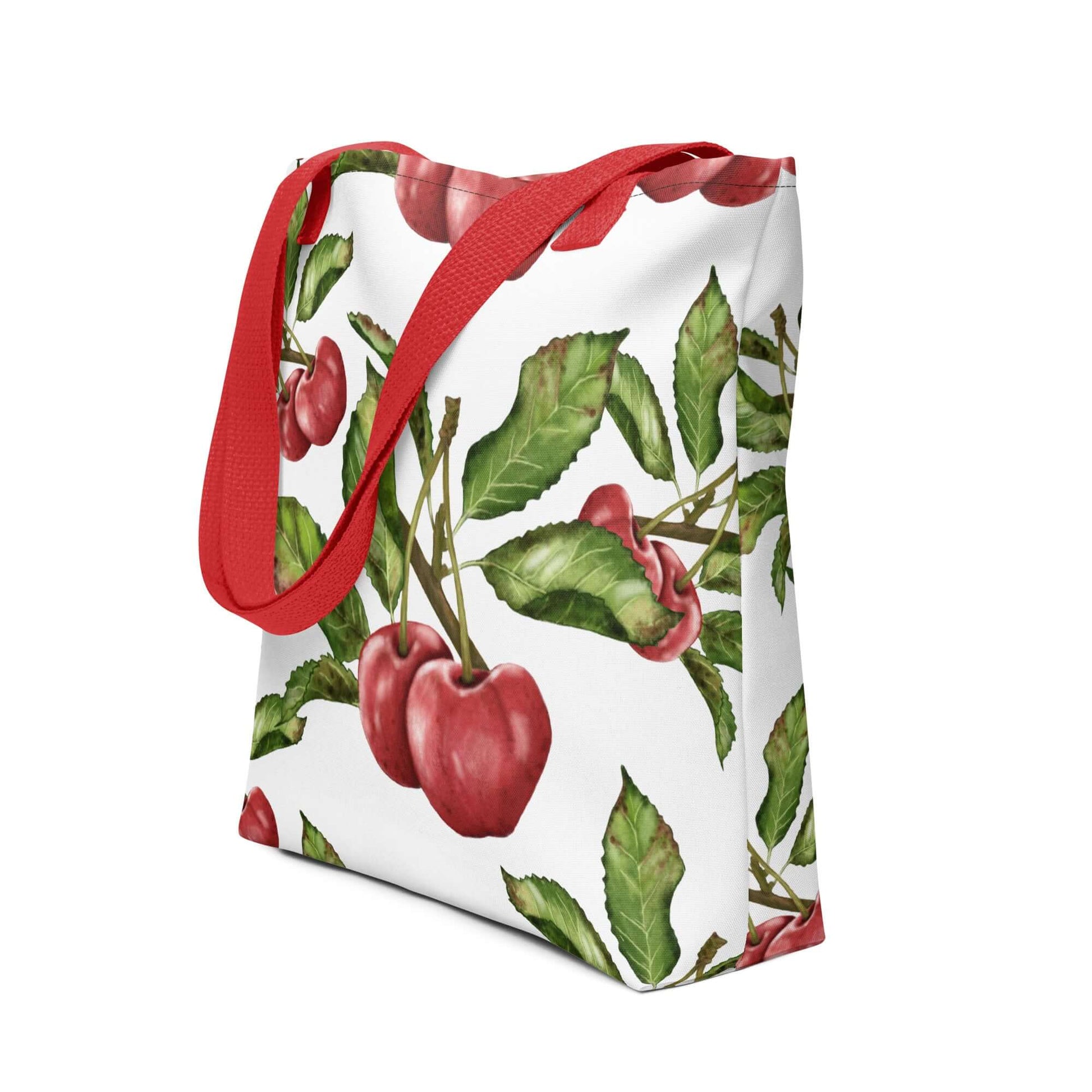 Orchard Bloom Cherry Canvas Tote featuring vibrant cherry illustrations and a sturdy red strap. Perfect for gifts and everyday use.