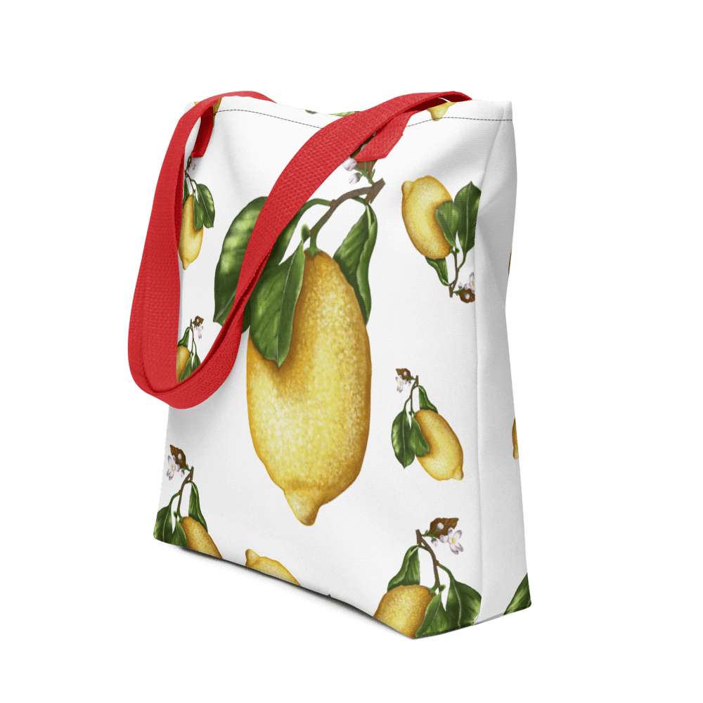 Lemon all-over print tote bag with red handles displayed prominently
