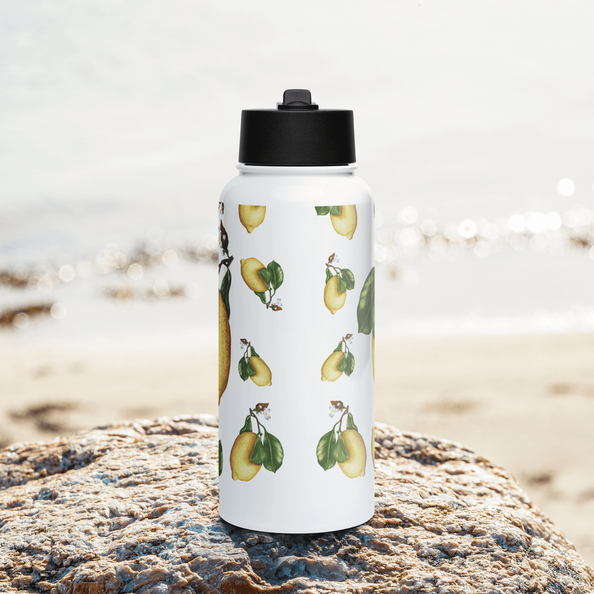 Vibrant lemon water bottle featuring artful lemon and leaf design, perfect summer gift for health enthusiasts.