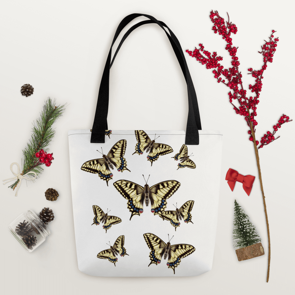 Machaon all-over print tote bag with black handles within Christmas decorations like red berry little branch
