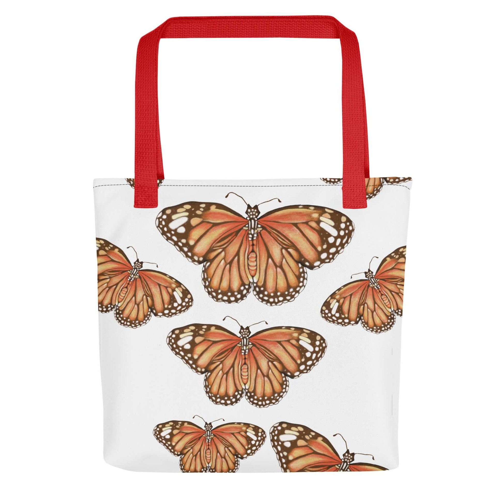 Butterfly Migration Canvas Tote with red handles, featuring a vibrant monarch butterfly design on a white background.