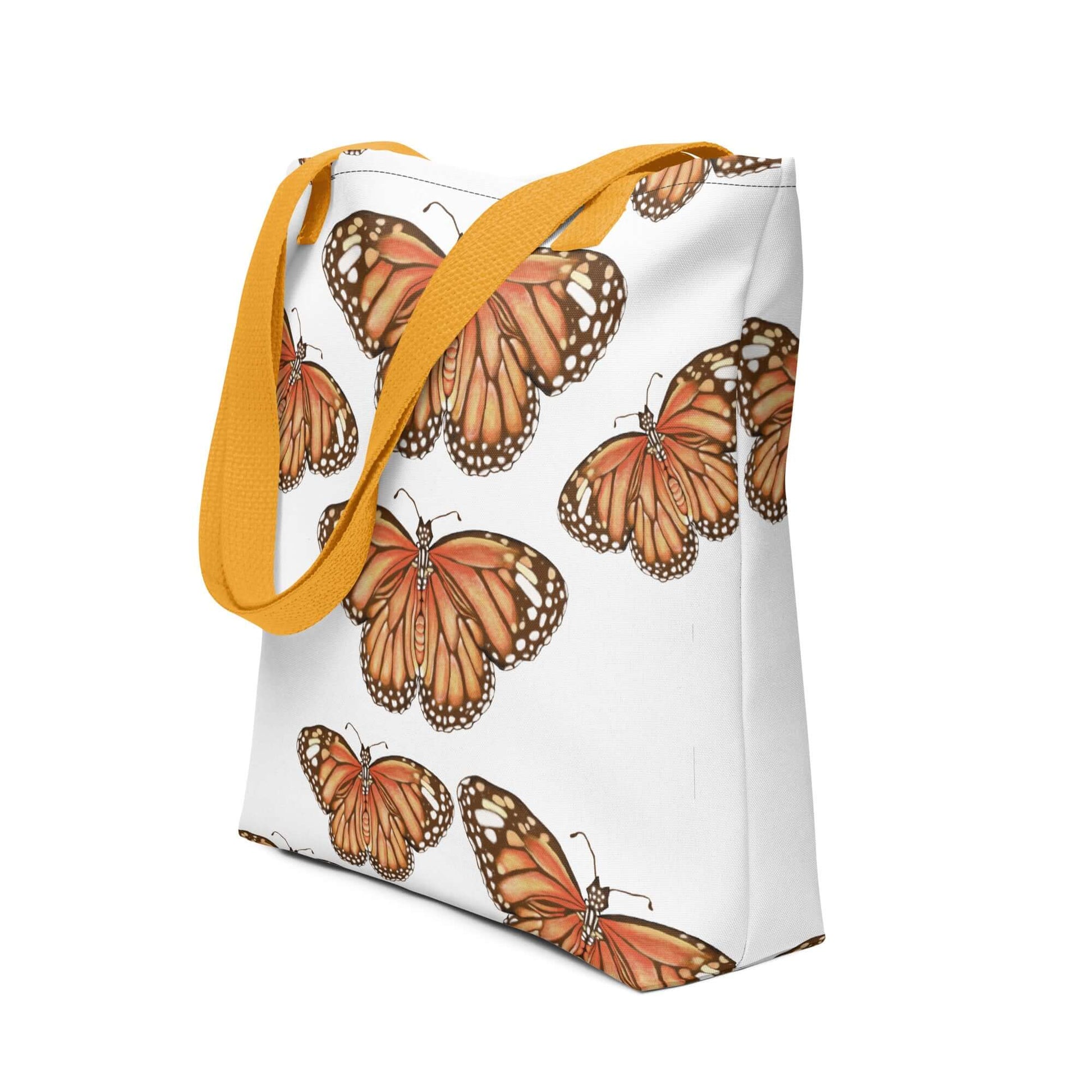 Butterfly migration canvas tote bag with vibrant monarch butterflies and yellow straps, perfect for nature lovers and gifts.