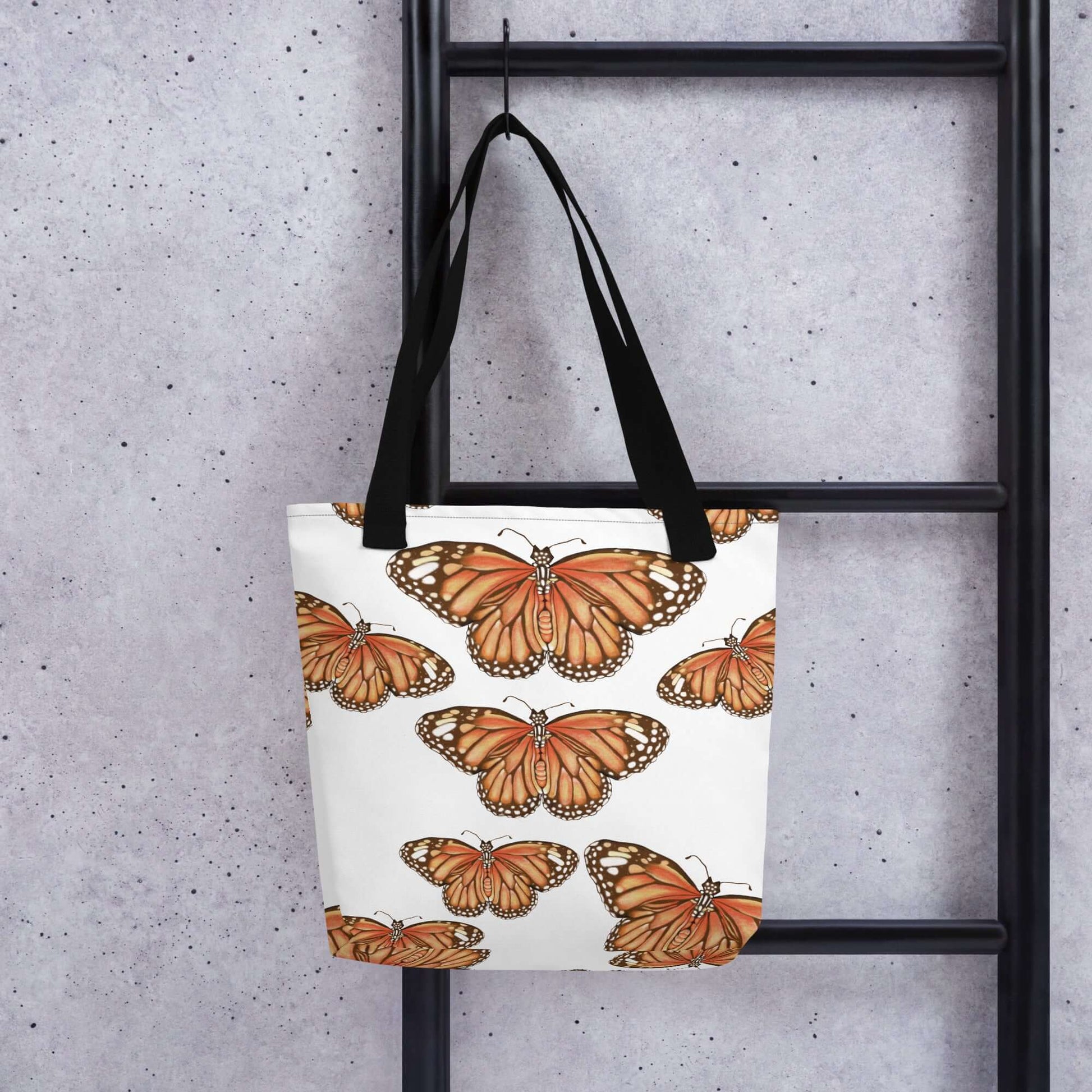 Butterfly Migration Canvas Tote showcasing vibrant monarch butterflies, perfect for gifts and daily use.