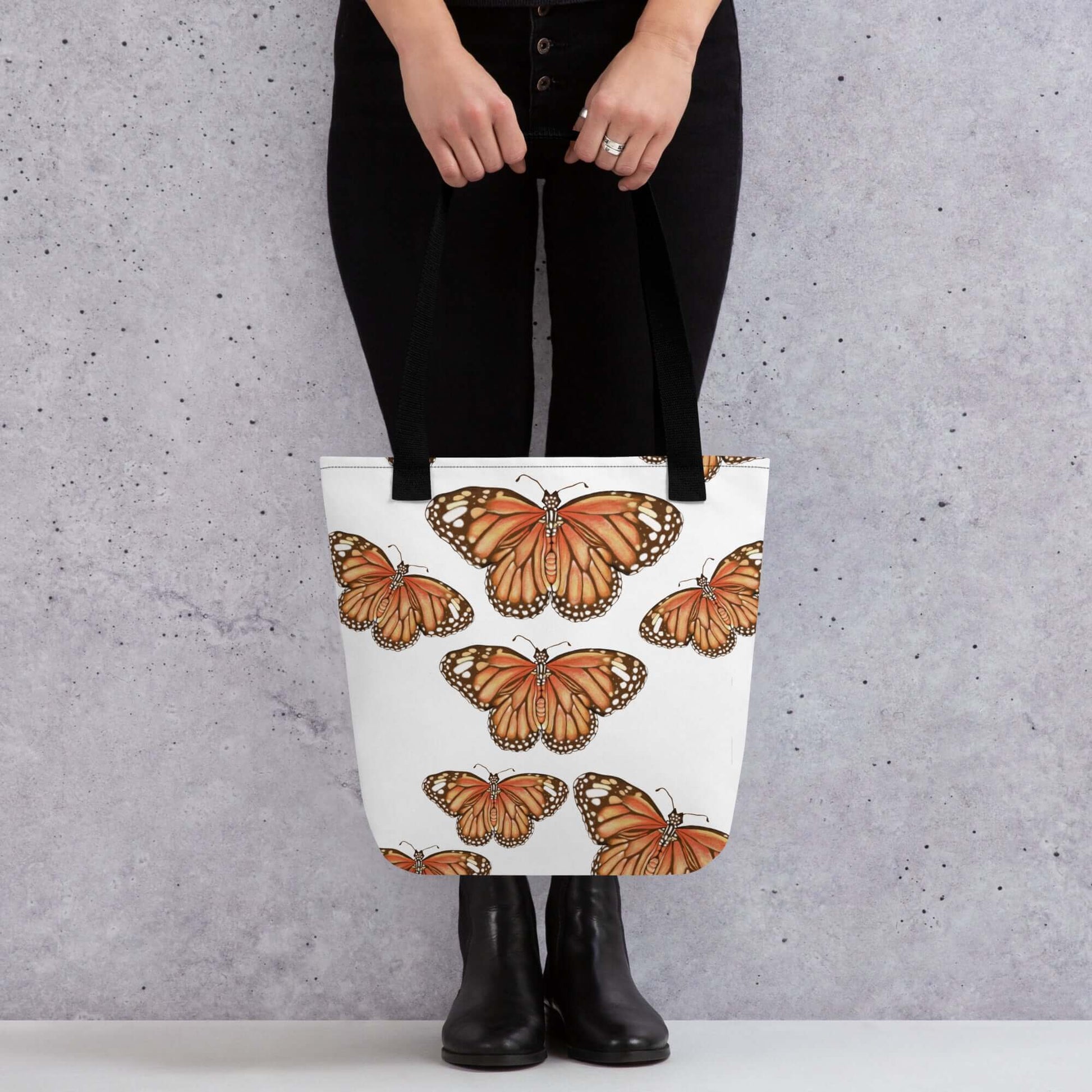 Butterfly Migration Canvas Tote bag featuring vibrant monarch butterflies, perfect for nature lovers and as a thoughtful gift.