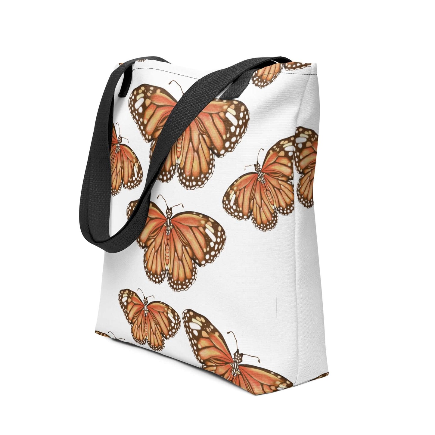 Butterfly Migration Canvas Tote bag featuring vibrant monarch butterflies, perfect for nature lovers and stylish outings.