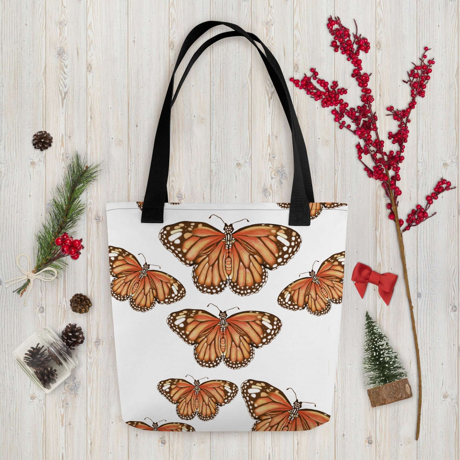 Butterfly Migration Canvas Tote Bag featuring vibrant monarch butterflies on a white background, perfect for nature lovers.