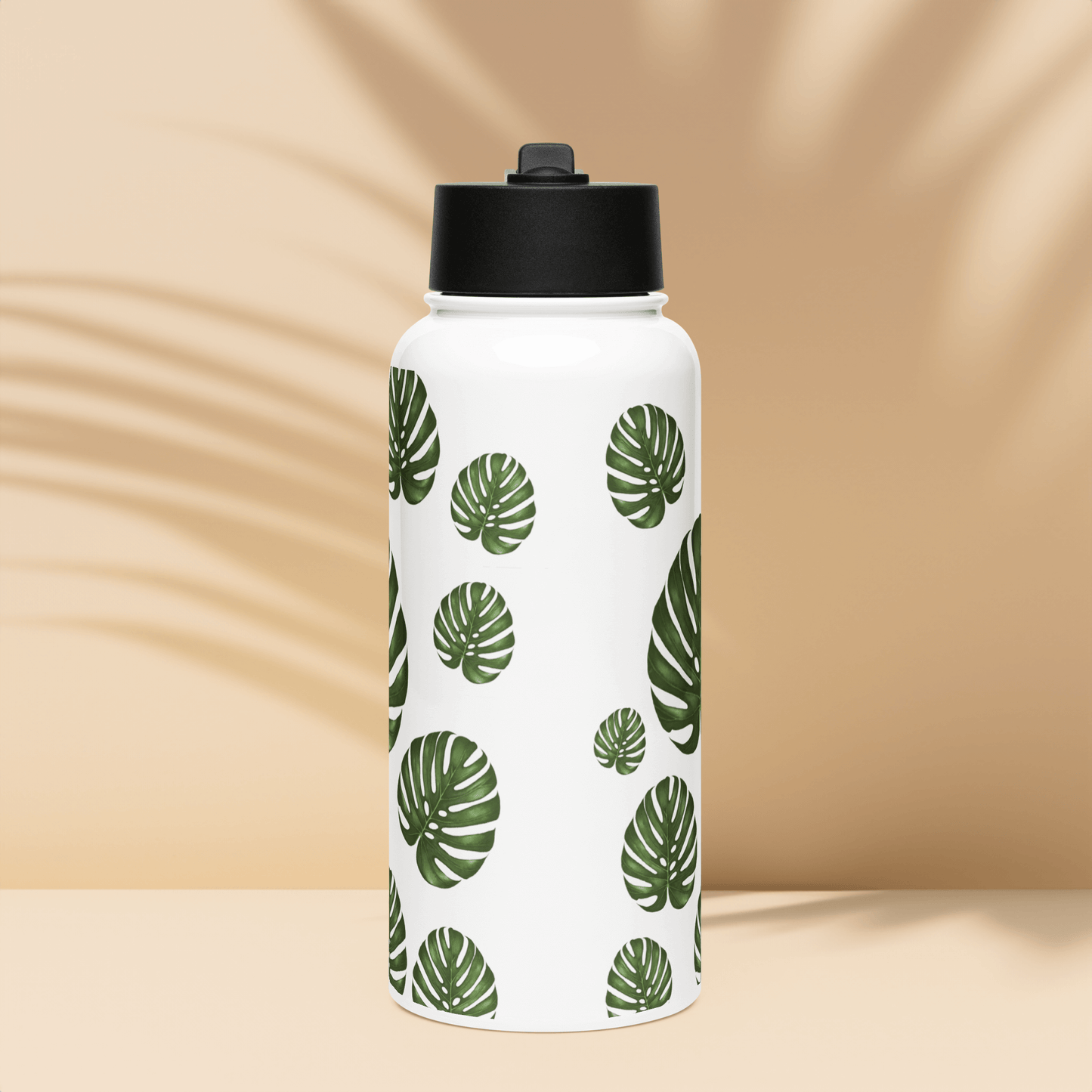 Tropical Monstera water bottle with bold green leaves, ideal gift for plant lovers and a stylish drinkware accessory.