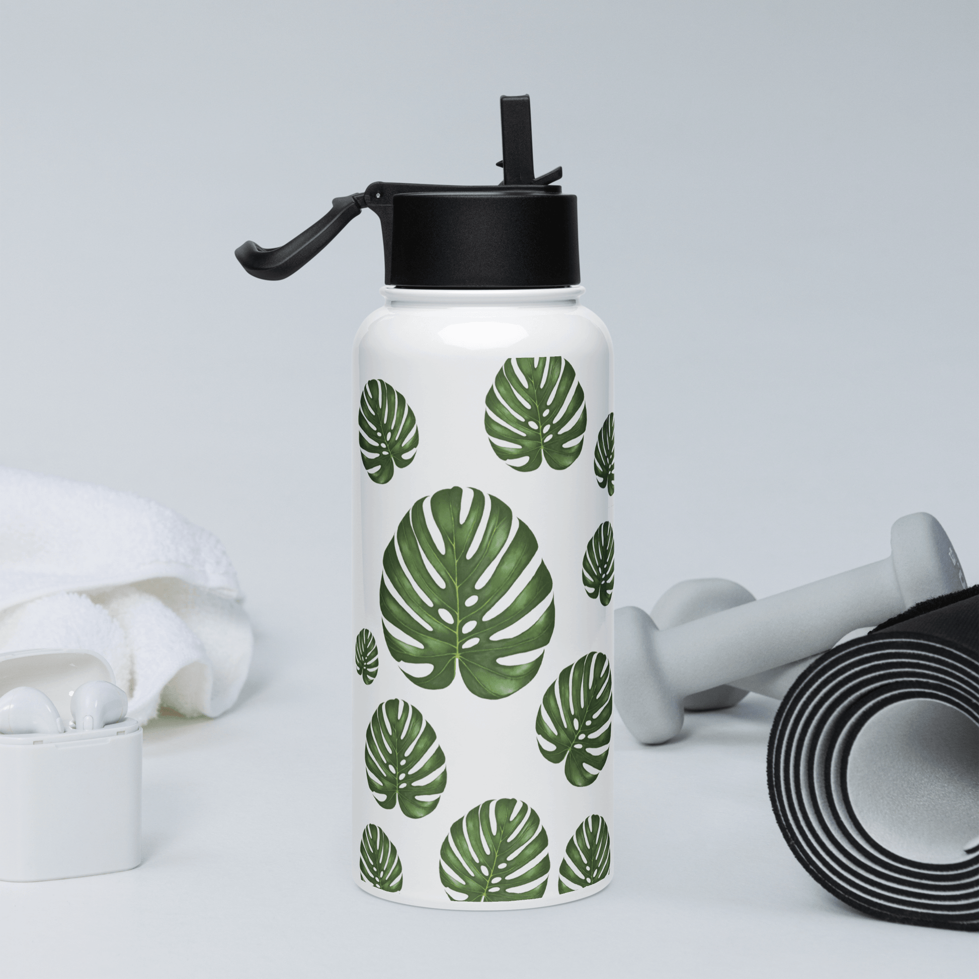 Tropical Monstera water bottle, perfect gift for plant lovers and active lifestyles, featuring vibrant green leaf design.