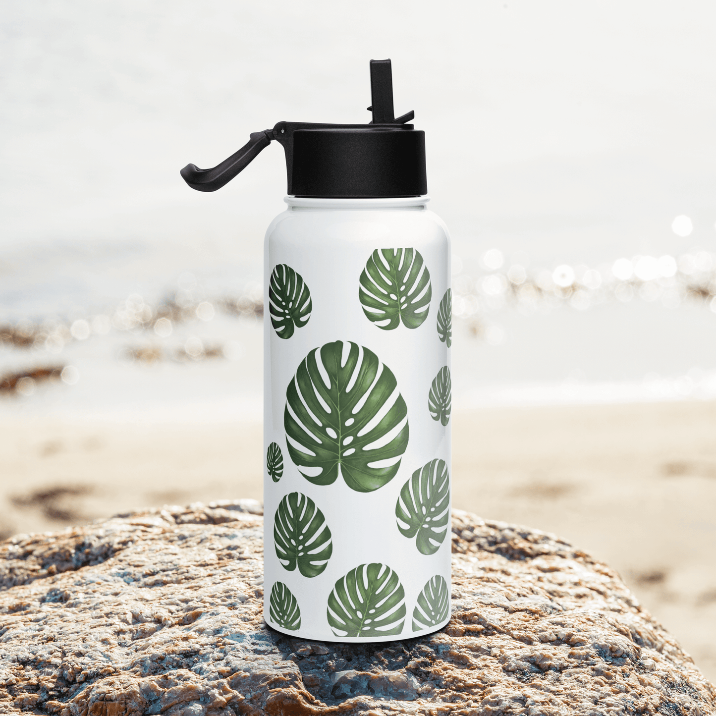 Tropical Monstera water bottle with green leaf design, perfect gift for plant lovers and modern drinkware enthusiasts.