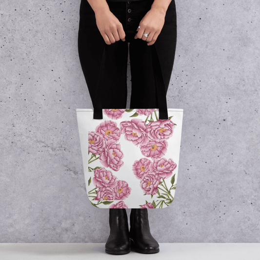 Peony all-over print with black handles held by a person dressed in black with both hands holding it in front