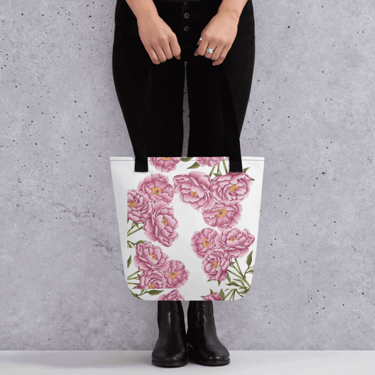 Peony all-over print with black handles held by a person dressed in black with both hands holding it in front