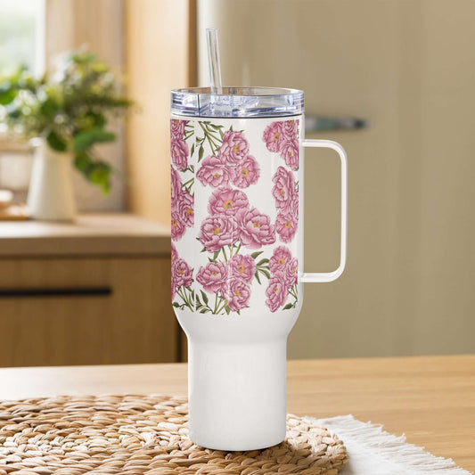 Peony design insulated tumbler with handle and straw on a kitchen table, perfect for travel or everyday hydration.