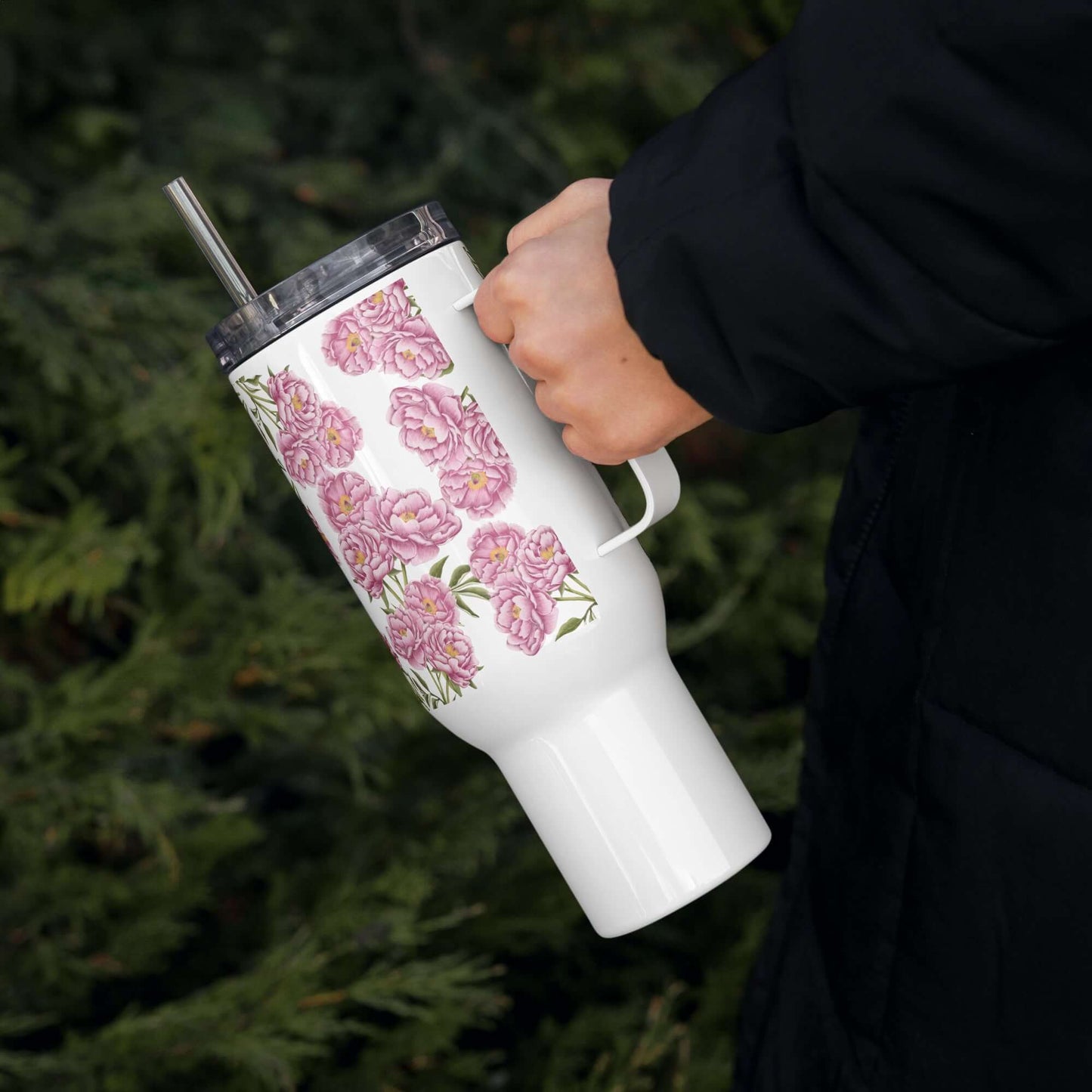 Hand holding a Peony Design 40oz insulated tumbler with straw, perfect for stylish hydration on the go.