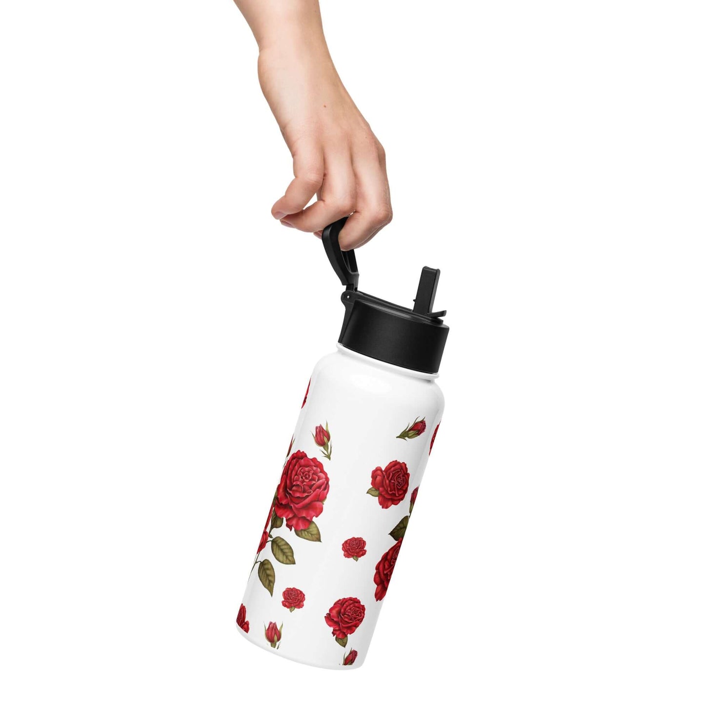 An ergonomic rose water bottle is held firmly in one hand, showcasing the delicate details of the romantic red rose pattern that wraps around its form.