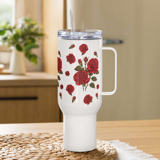 A 40 oz travel mug with a Rose design placed on a clean kitchen counter with a classic fridge in the background.