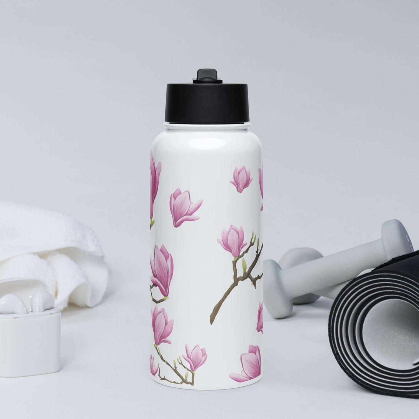 Front view in the gym: Stylish magnolia water bottle, adding a touch of femininity to your workout routine.