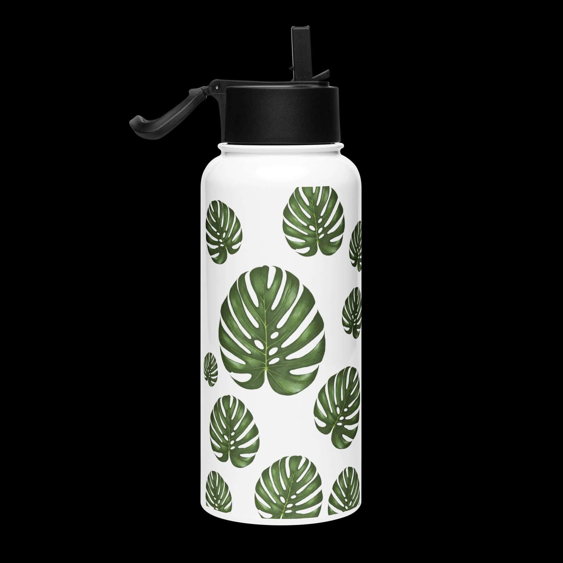 Side view with dark background: Bold and striking monstera water bottle, standing out against a dark background.