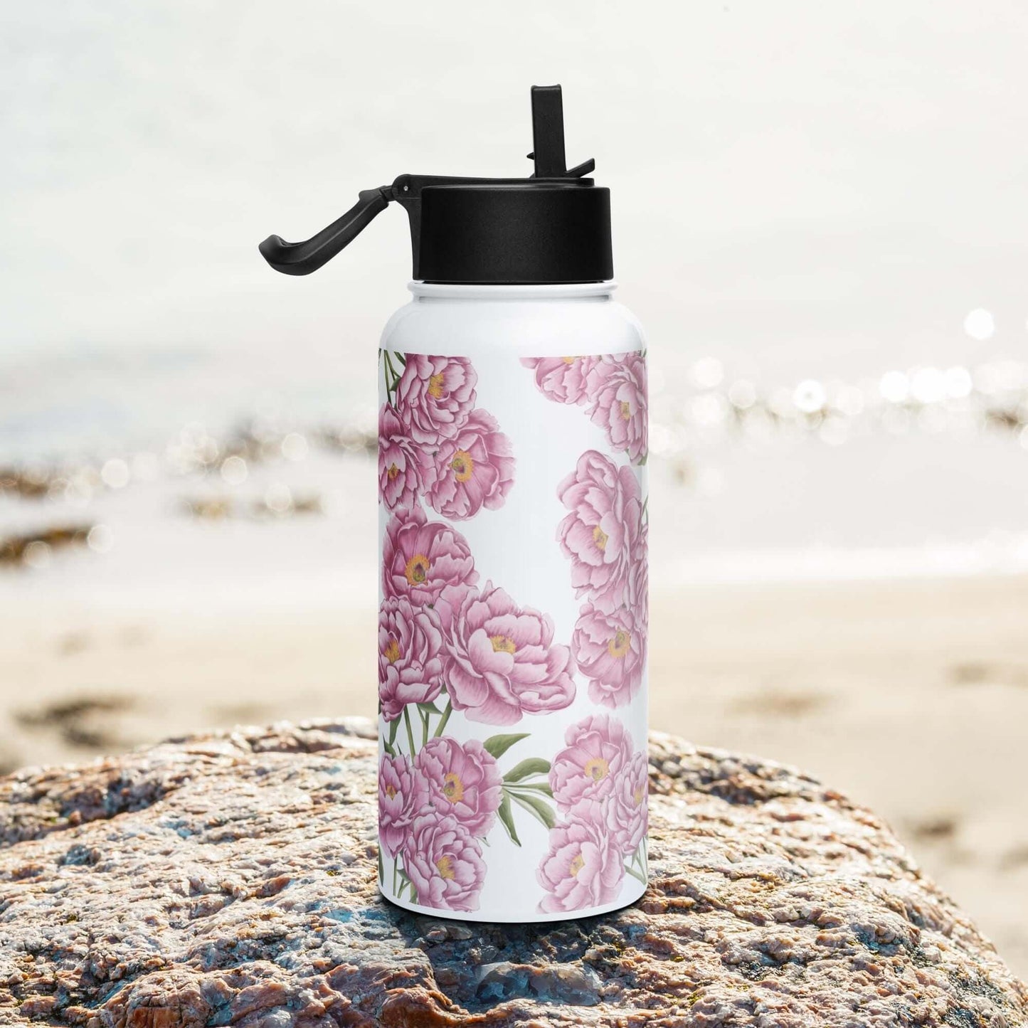 Side view on the beach: Sleek silhouette of the peony water bottle, complementing your active lifestyle.