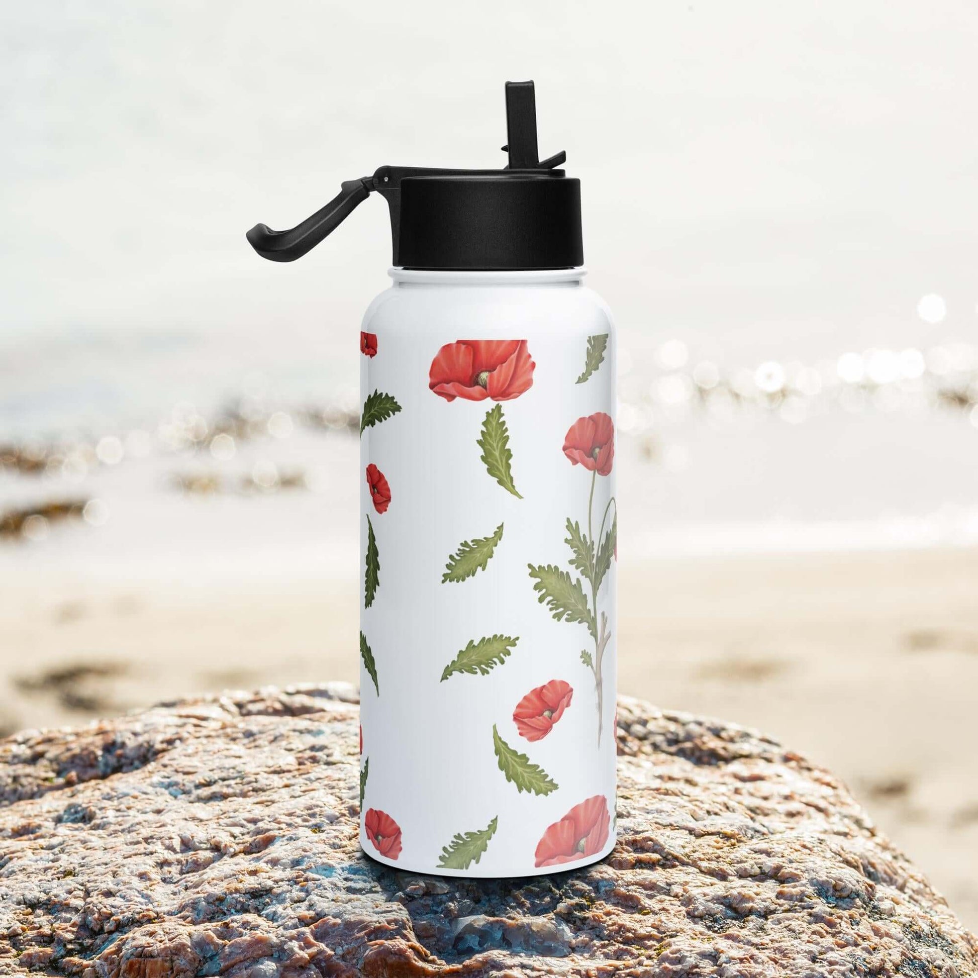 Side view on the beach: Sleek and modern poppy water bottle, complementing your beach attire.