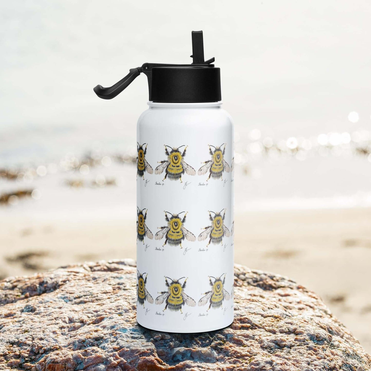 Side view on the beach: Sleek and modern Bumblebee water bottle, complementing your beach attire.