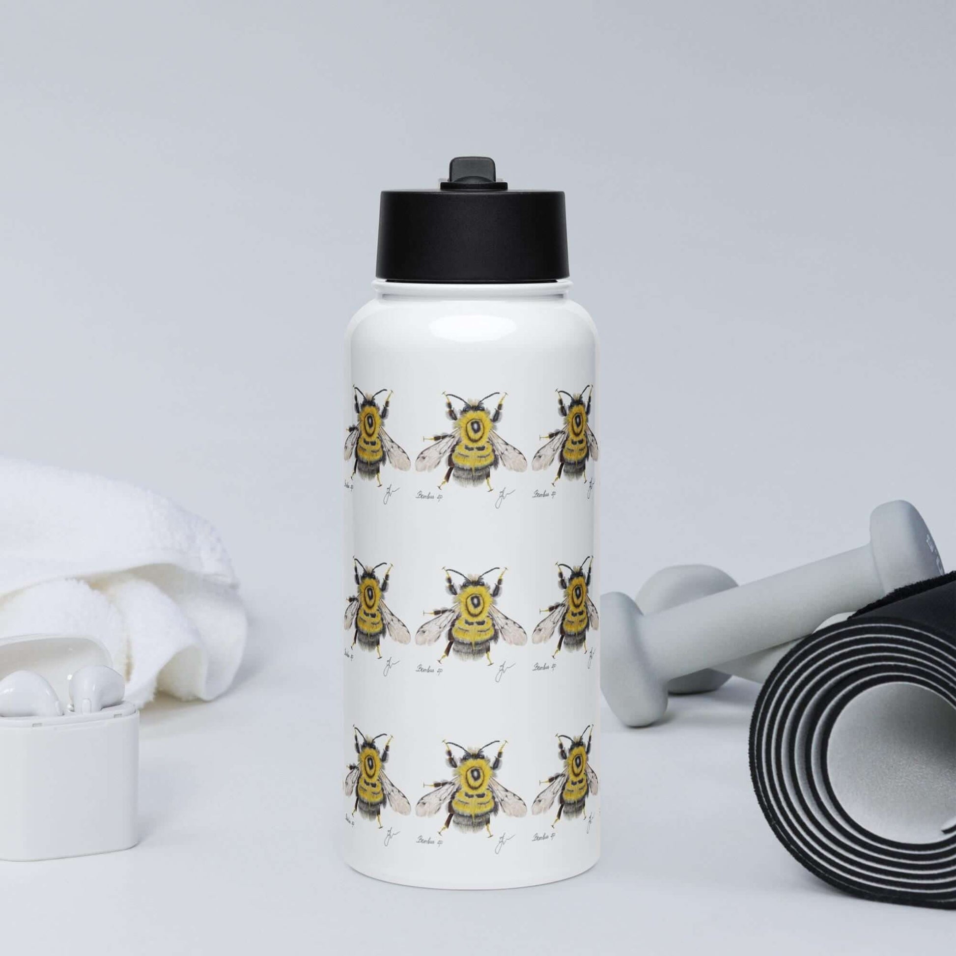 Front view in the gym: Energetic Bumblebee water bottle, fueling your workout with hydration.