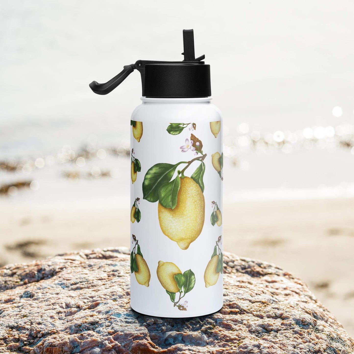 Side view on the beach: Sleek and stylish lemon water bottle, complementing your beach attire.