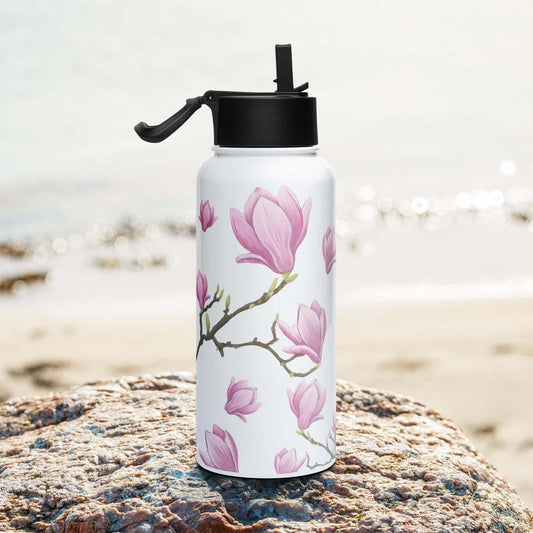 Side view on the beach: Sleek silhouette of the magnolia water bottle, complementing your active lifestyle.